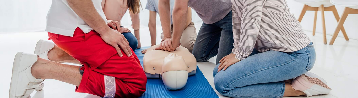 group of student practicing CPR